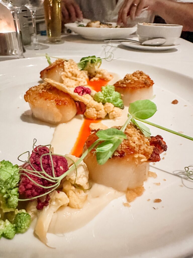 The scallop entree enjoyed at the Beachhouse Restaurant at the Moana Surfrider Hotel in Waikiki, Hawaii.
