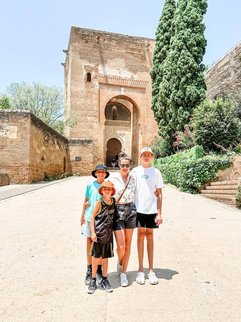Bec Bowman, Sydney Travel Blogger, standing outside of the Alhambra, Granada, Spain
