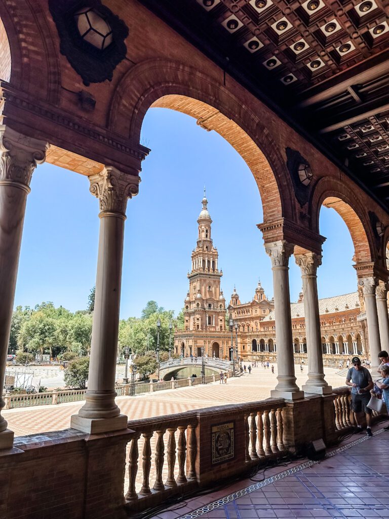 A view of the Alcazar in Seville taken from the shade of the veranda on a hot summers day. Family trip to Spain from Australia.