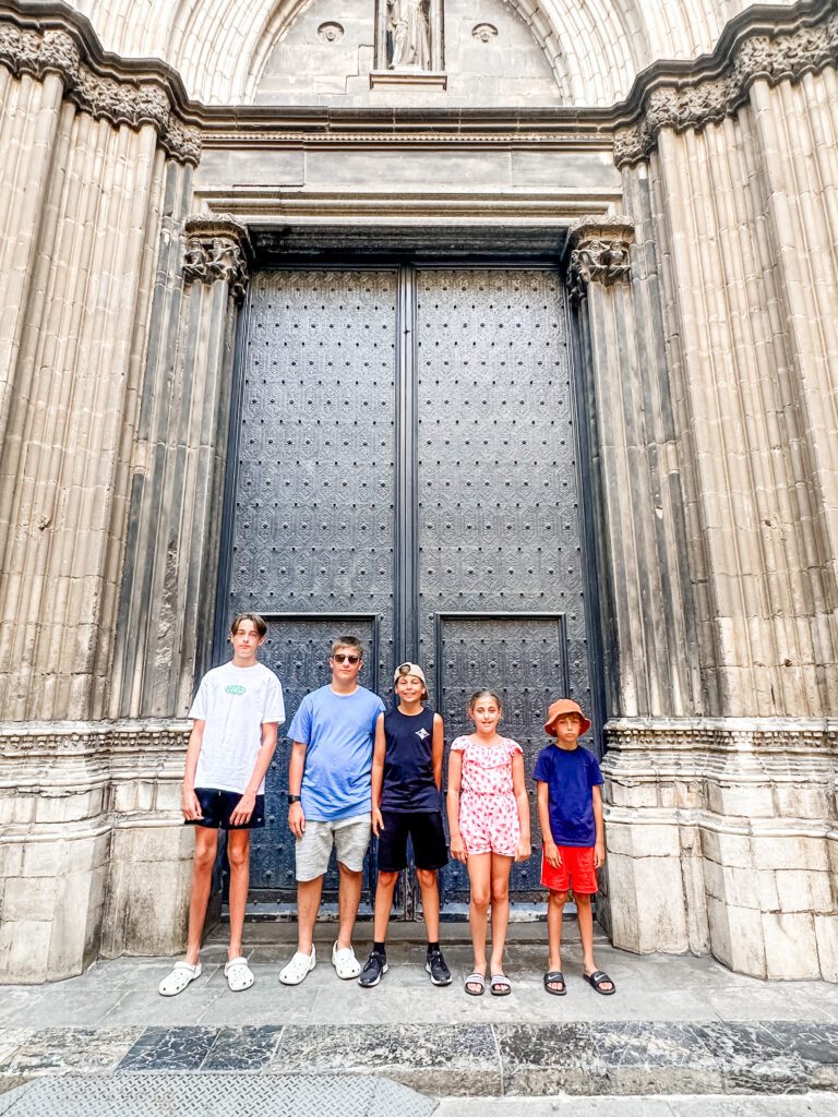 Cousins trip to Barcelona, Spain. Aussie kids photographed with their British cousins, outside the door of Barcelona Cathedral in Spain