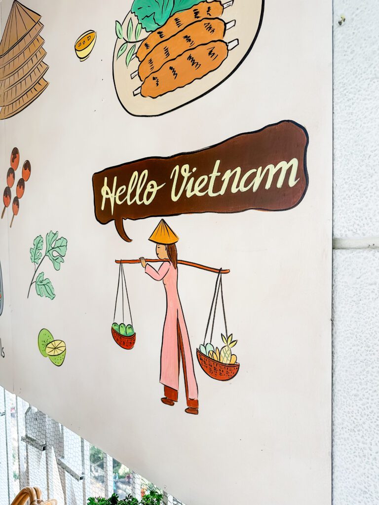 A colourful mural in Saigon with the caption 'Hello Vietnam'